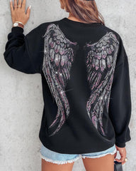 Bluza z długim rękawem i nadrukiem w kształcie serca, ozdobiona kryształkami