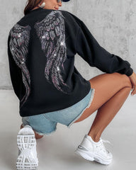 Bluza z długim rękawem i nadrukiem w kształcie serca, ozdobiona kryształkami