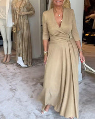 Elegancka, jednokolorowa sukienka z dekoltem w serek i rękawami trzy czwarte