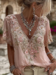 Damska koszulka z krótkim rękawem i dekoltem w serek, wykonana z mieszanki lnu i ozdobiona haftowanymi kwiatami