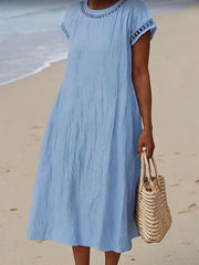 Damska swobodna bawełniana sukienka z okrągłym dekoltem i krótkim rękawem i kieszenią
