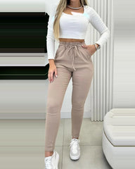 Obcisłe spodnie z podszewką z polaru i sznurkiem w talii