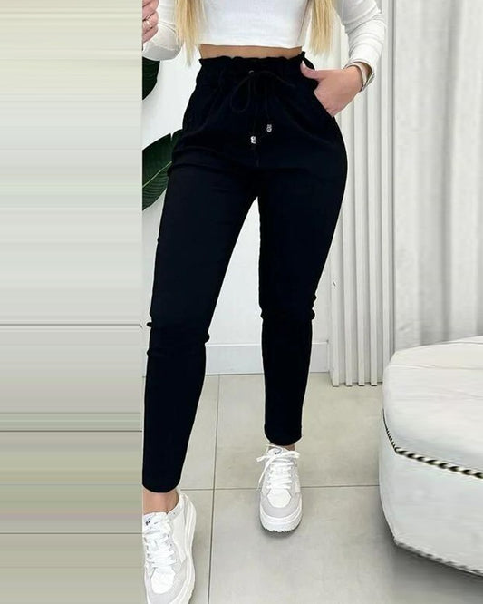 Obcisłe spodnie z podszewką z polaru i sznurkiem w talii