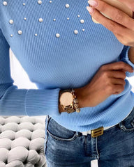 Sweter z dzianiny o luźnym kroju, z okrągłym dekoltem i zamkiem błyskawicznym. Top o dopasowanym kroju