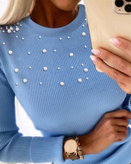 Sweter z dzianiny o luźnym kroju, z okrągłym dekoltem i zamkiem błyskawicznym. Top o dopasowanym kroju