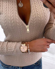 Sweter z dzianiny o luźnym kroju, z okrągłym dekoltem i zamkiem błyskawicznym. Top o dopasowanym kroju