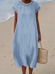 Damska swobodna bawełniana sukienka z okrągłym dekoltem i krótkim rękawem i kieszenią
