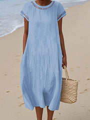 Damska swobodna bawełniana sukienka z okrągłym dekoltem i krótkim rękawem i kieszenią