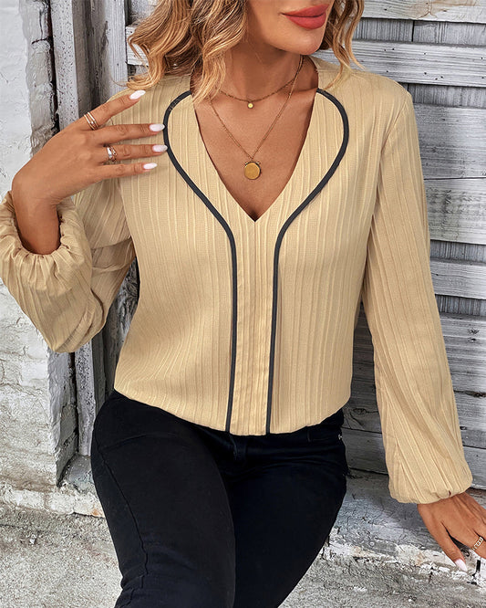 Elegancka bluzka z długim rękawem i dekoltem w kształcie litery V